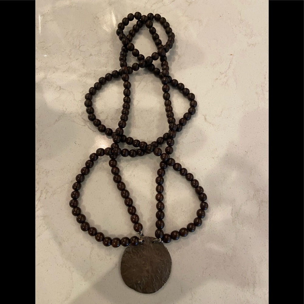 long necklace with wooden beads and pendant